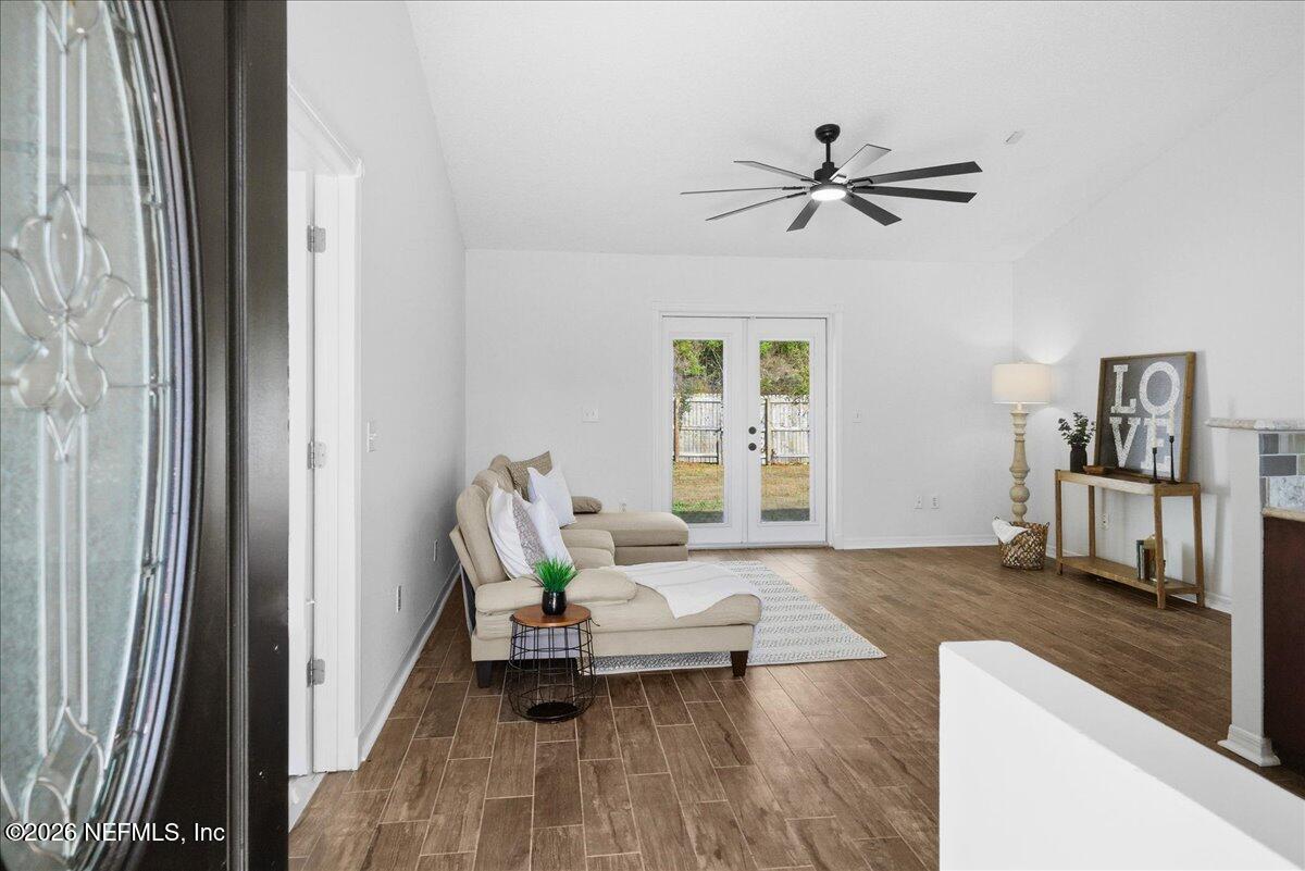 425 3rd Street West Baldwin, FL 32234 - Photo 3 of 47 a living room with a bed furniture and a window