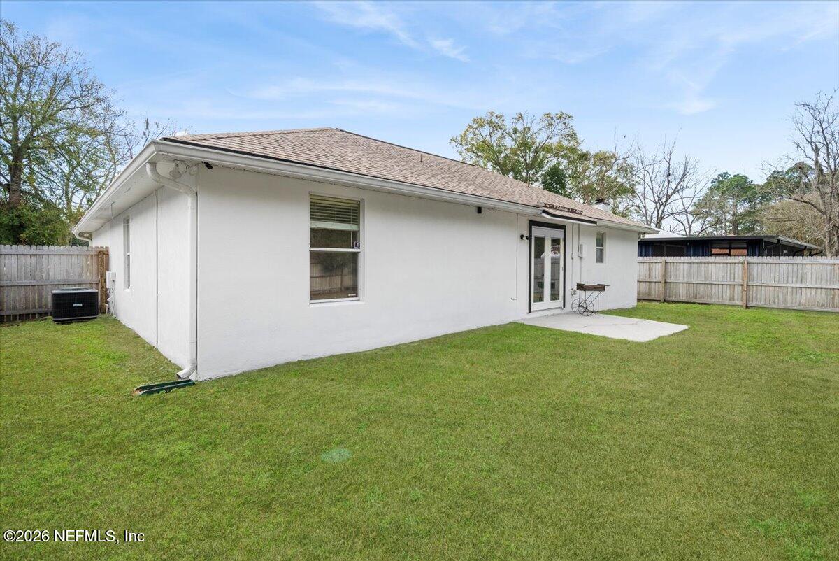 425 3rd Street West Baldwin, FL 32234 - Photo 31 of 47 a view of a house with a backyard