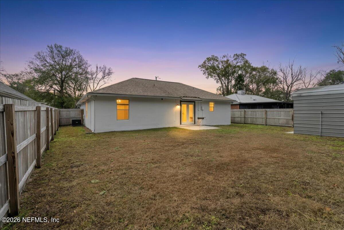 425 3rd Street West Baldwin, FL 32234 - Photo 35 of 47 a front view of a house with a garden