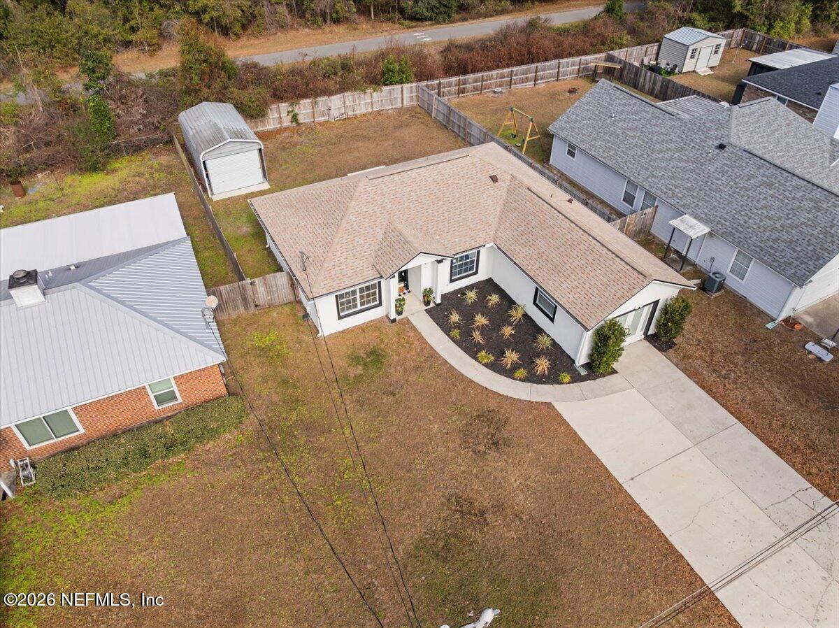 425 3rd Street West Baldwin, FL 32234 - Photo 37 of 47 an aerial view of a house with garden space and sitting space