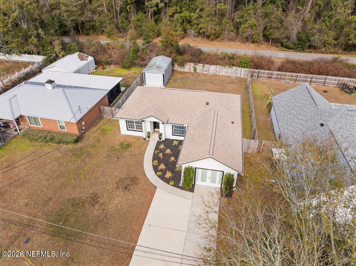 425 3rd Street West Baldwin, FL 32234 - Photo 39 of 47 an aerial view of a house with swimming pool