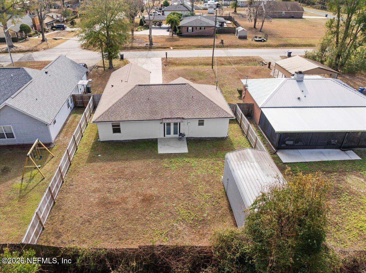 425 3rd Street West Baldwin, FL 32234 - Photo 41 of 47 an aerial view of a house with swimming pool
