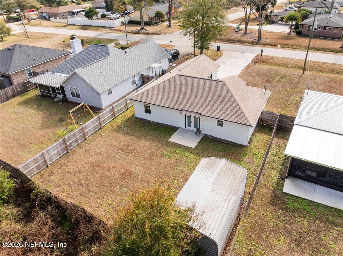 425 3rd Street West Baldwin, FL 32234 - Photo 42 of 47 a view of a swimming pool with a lounge chairs