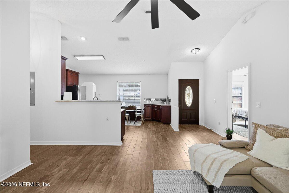 425 3rd Street West Baldwin, FL 32234 - Photo 7 of 47 a living room with furniture and kitchen view