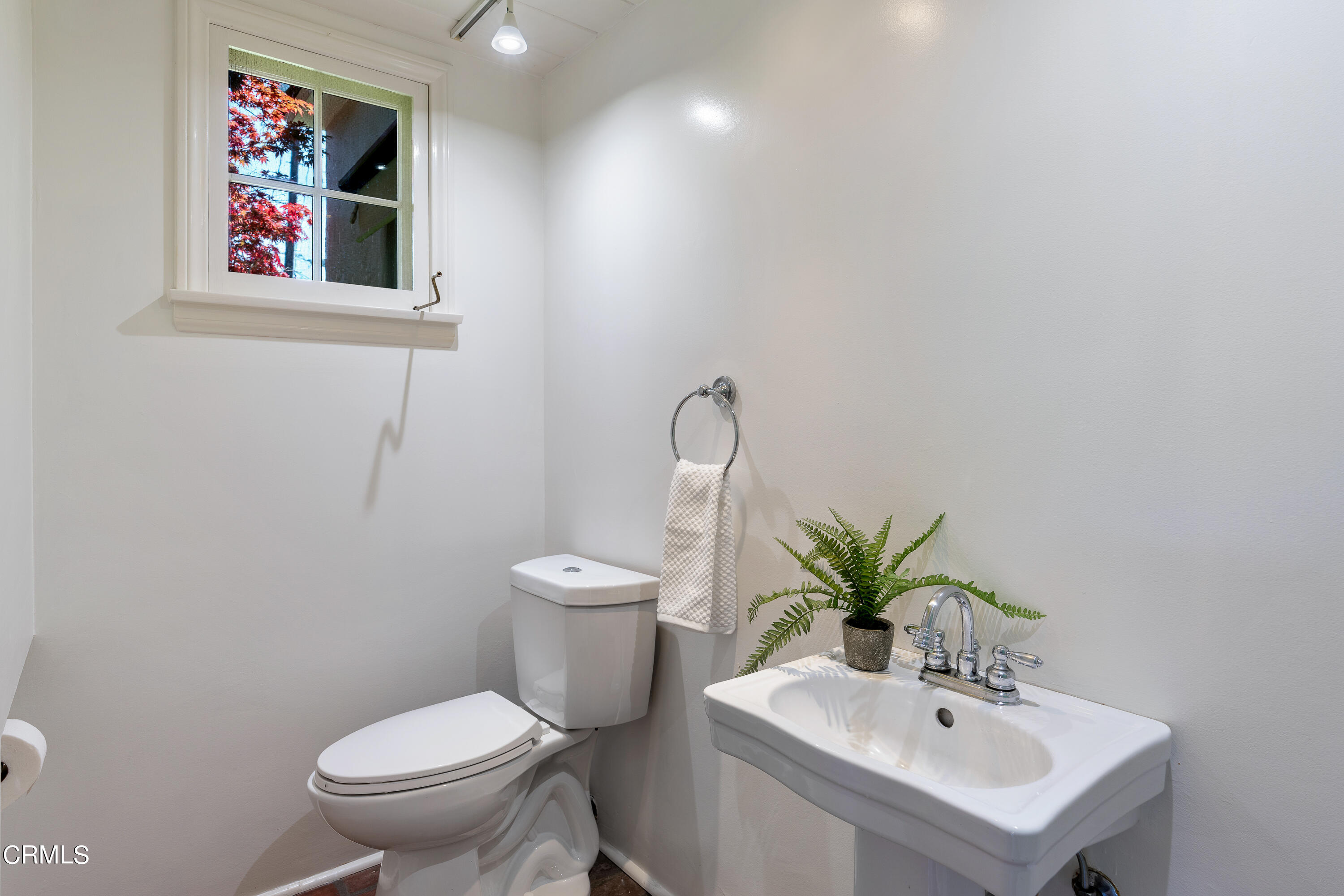 3642 Yorkshire Road Pasadena, CA 91107 - Photo 15 of 37 a white toilet sitting next to a bathroom sink