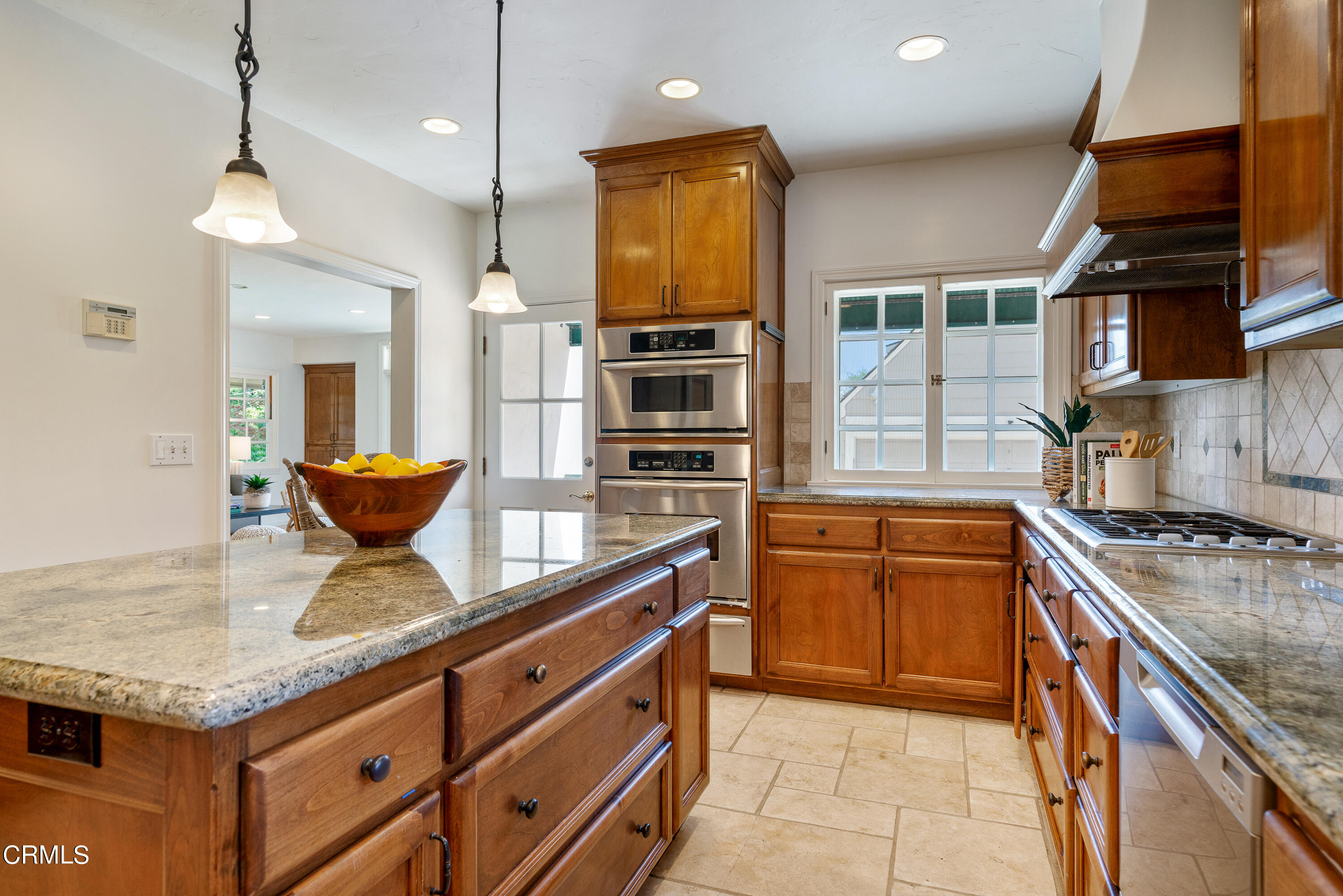 3642 Yorkshire Road Pasadena, CA 91107 - Photo 8 of 37 a kitchen with stainless steel appliances granite countertop a stove a sink and a microwave