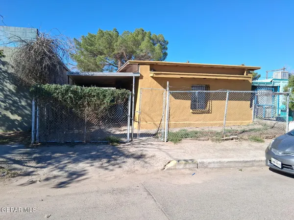 a view of a house with a street