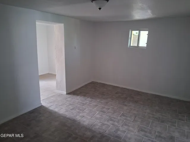 a view of kitchen with furniture and window