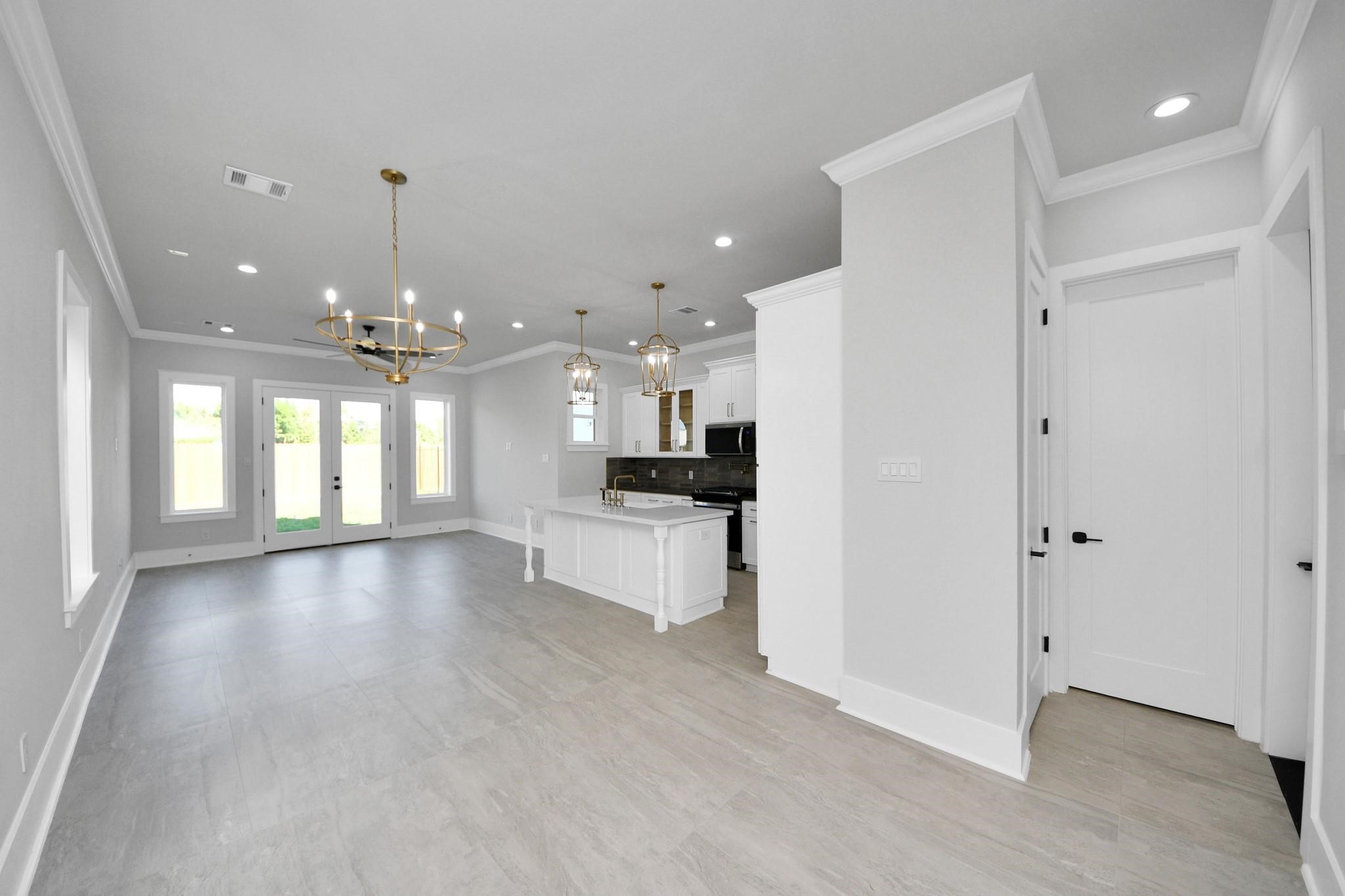 6320 Milwee Street, Unit B Houston, TX 77092 - Photo 10 of 30 a view of an empty room and kitchen with a window