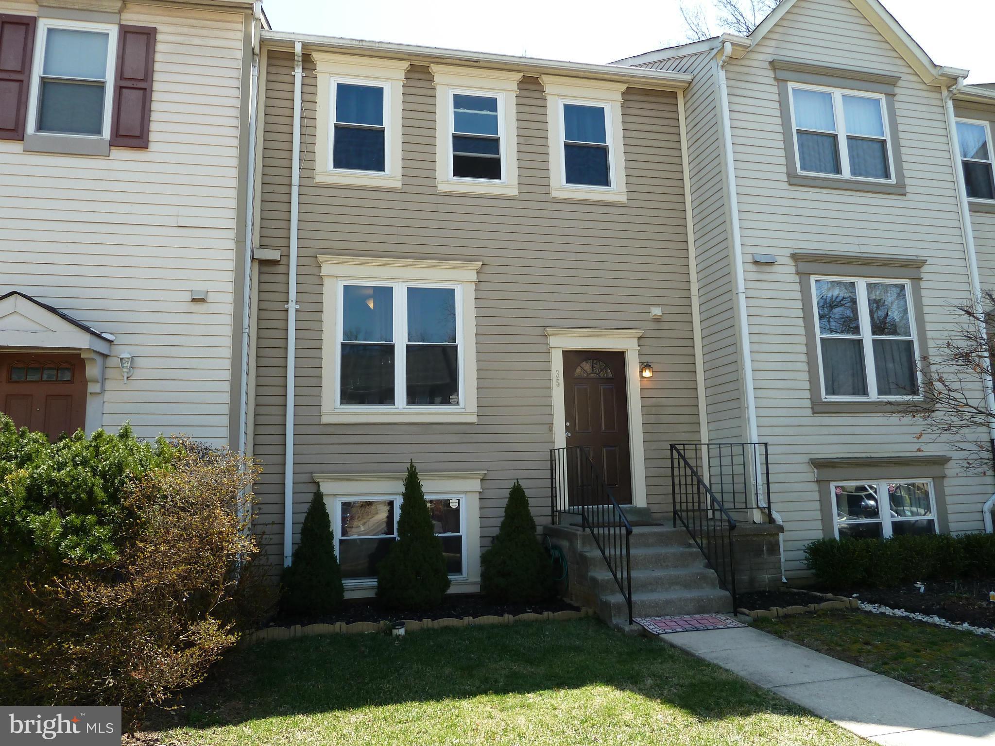 35 Kinsman View Circle Silver Spring, MD 20901 - Photo 1 of 30 a front view of a house with garden