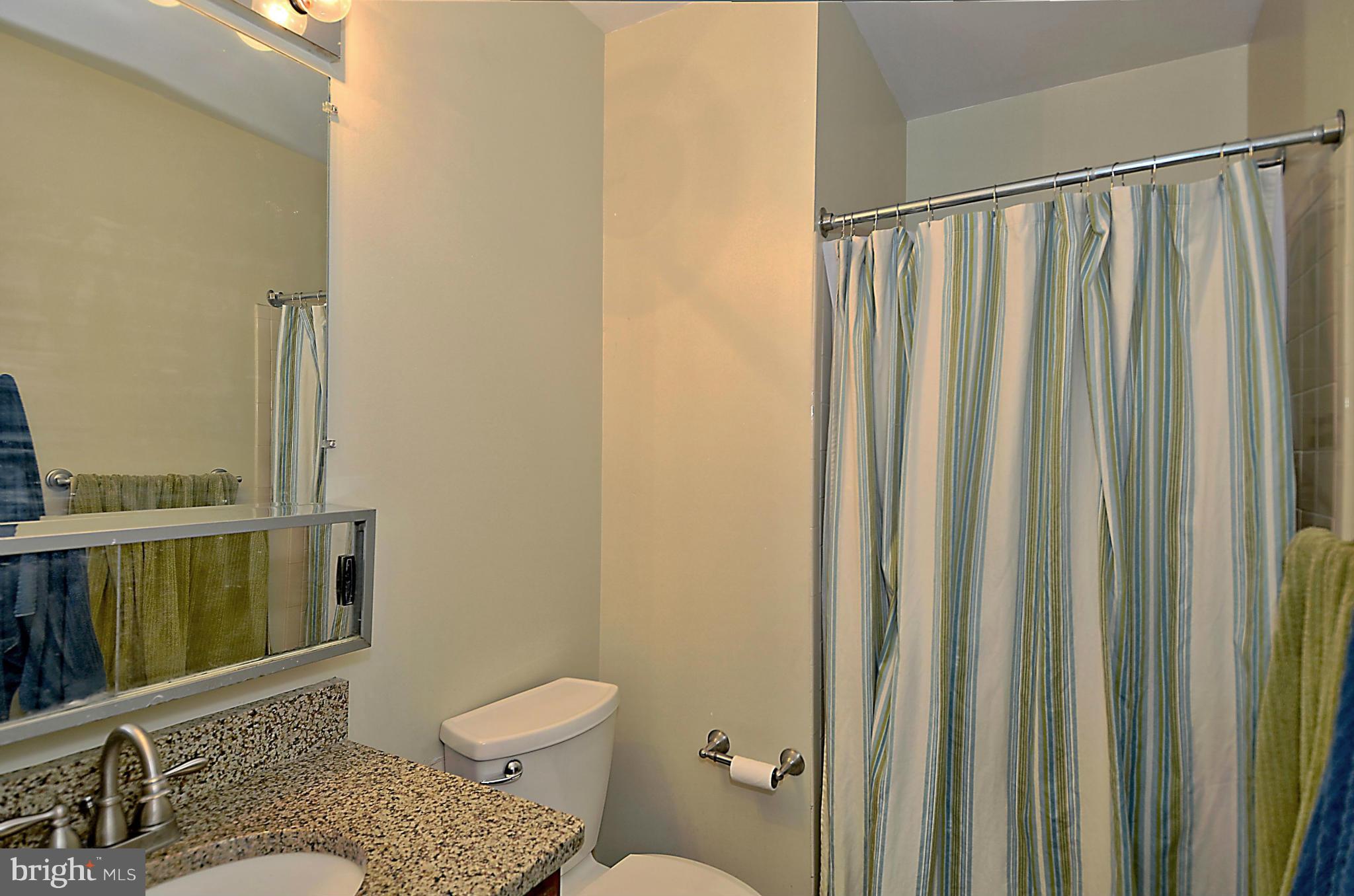 35 Kinsman View Circle Silver Spring, MD 20901 - Photo 17 of 30 a bathroom with a toilet a sink and a mirror