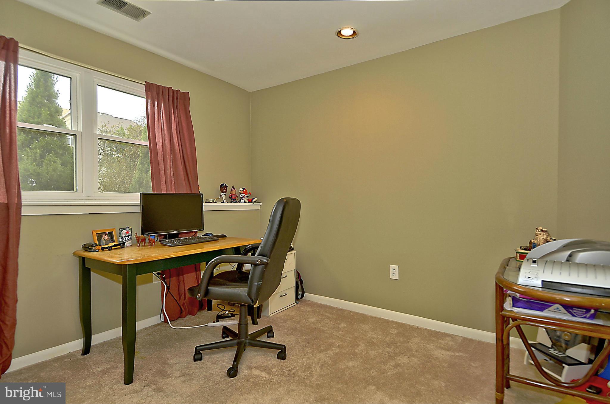 35 Kinsman View Circle Silver Spring, MD 20901 - Photo 21 of 30 a view of a workspace with furniture and a window