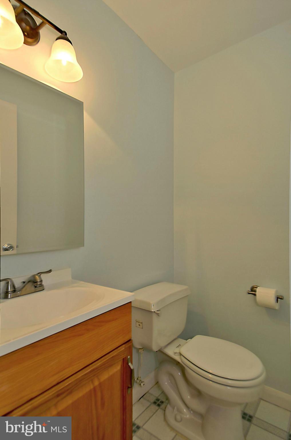 35 Kinsman View Circle Silver Spring, MD 20901 - Photo 25 of 30 a bathroom with a sink a toilet and a mirror