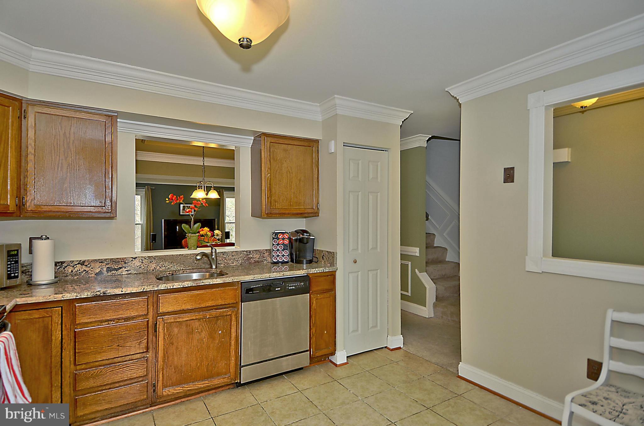 35 Kinsman View Circle Silver Spring, MD 20901 - Photo 4 of 30 a bathroom with a granite countertop sink and a mirror