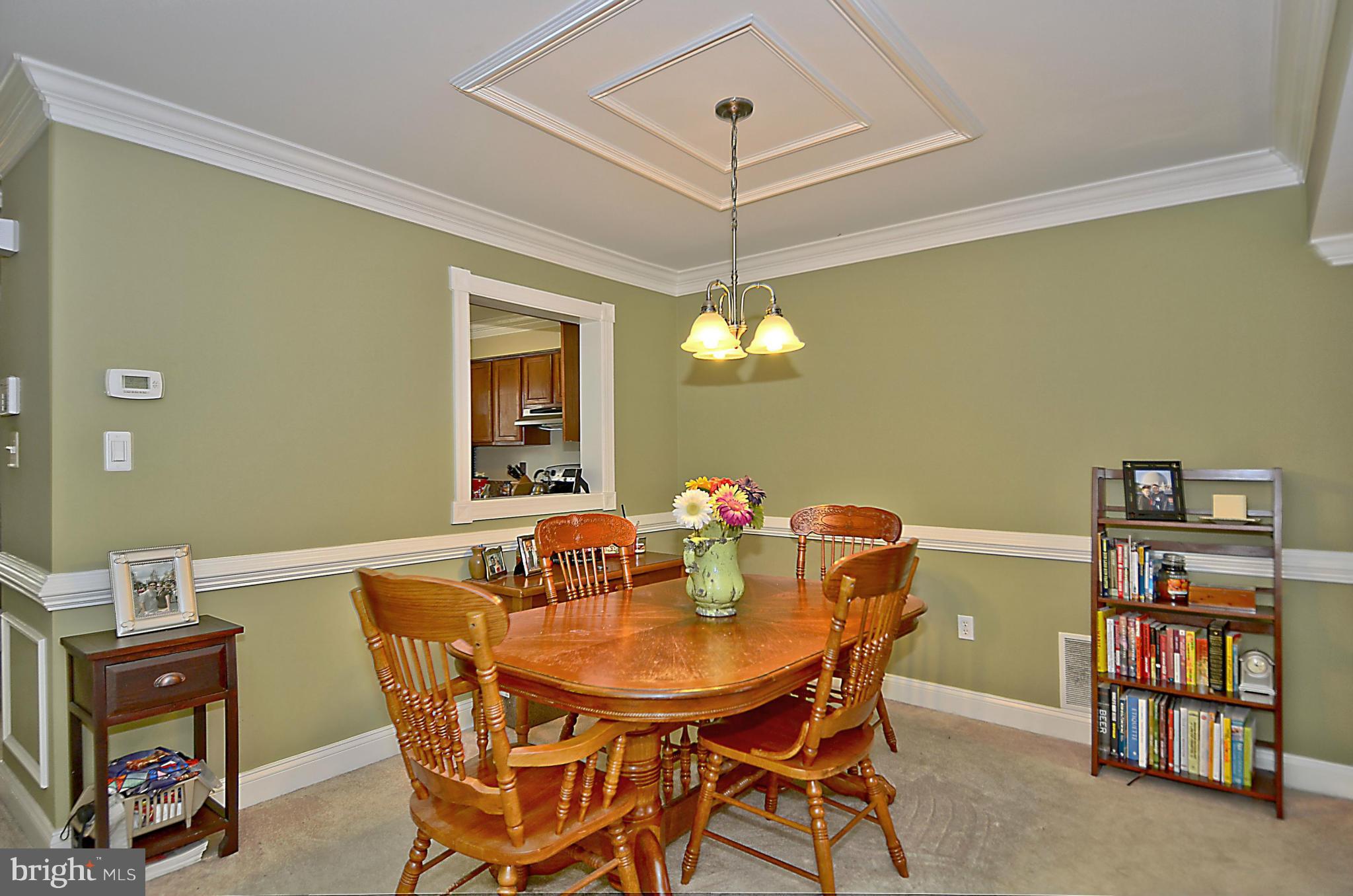 35 Kinsman View Circle Silver Spring, MD 20901 - Photo 6 of 30 a view of a dining room with furniture and a chandelier fan