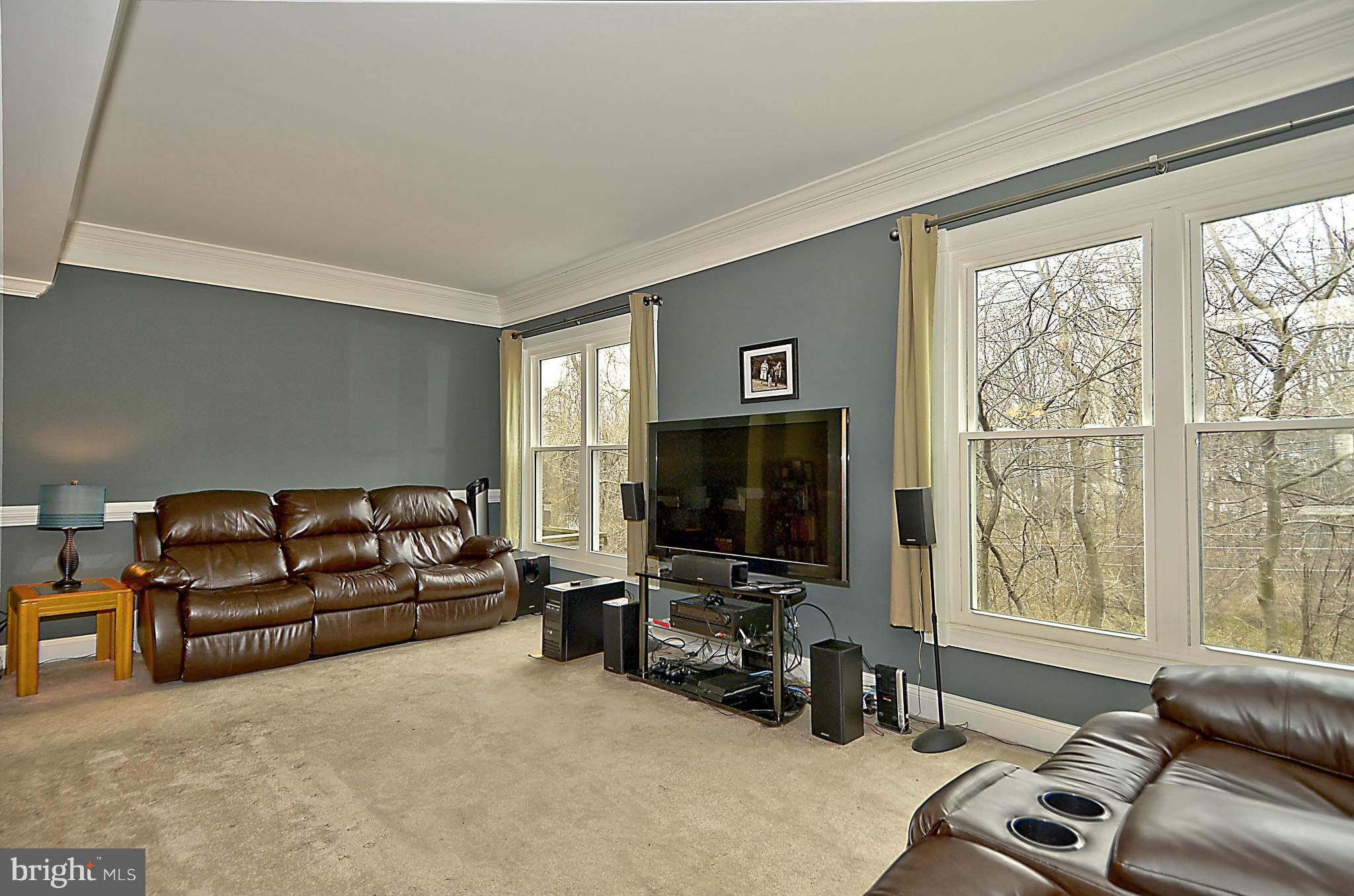 35 Kinsman View Circle Silver Spring, MD 20901 - Photo 7 of 30 a living room with furniture and a flat screen tv