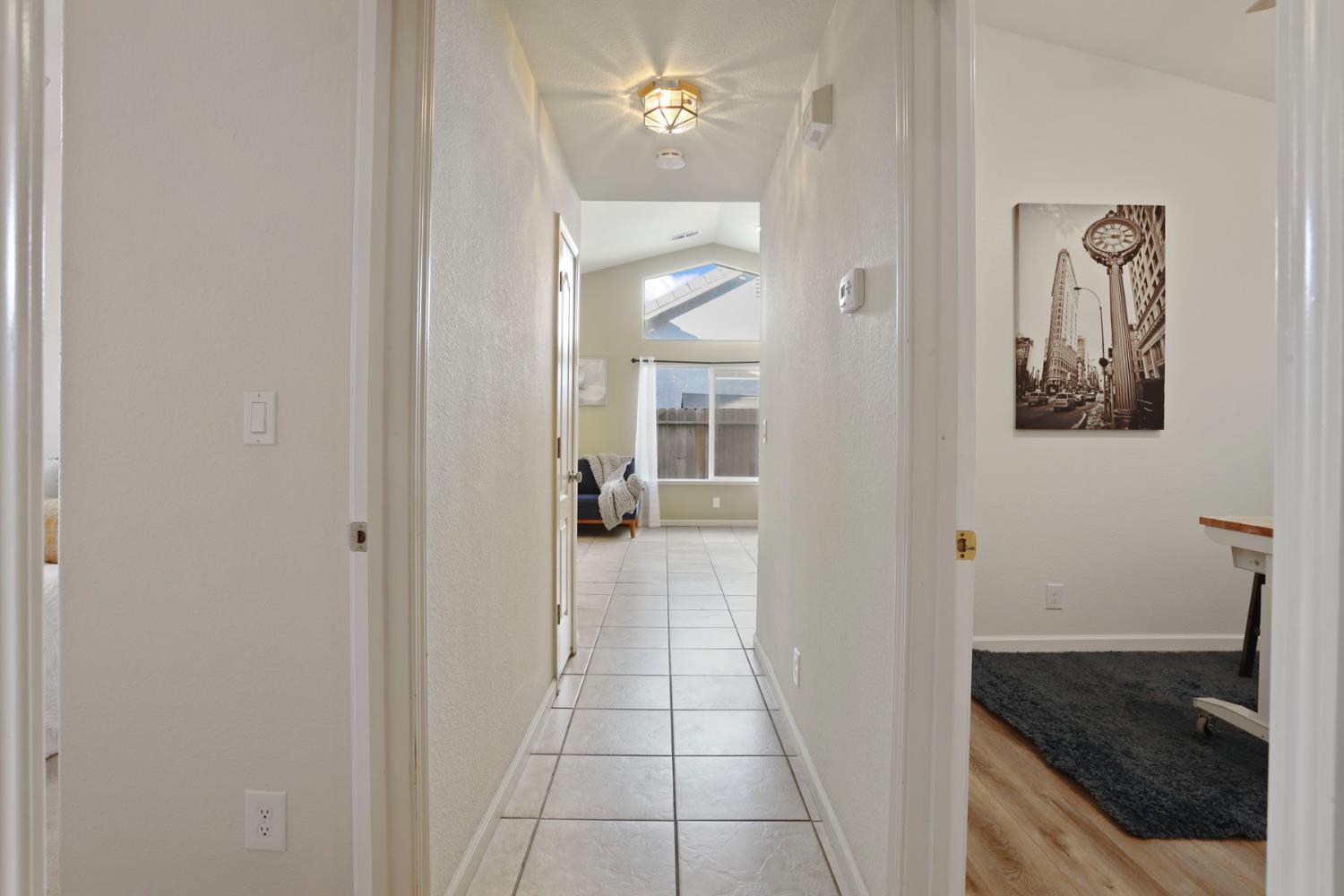 1505 Dreyfus Lane Modesto, CA 95355 - Photo 12 of 25 a bathroom with a granite countertop sink a mirror and vanity