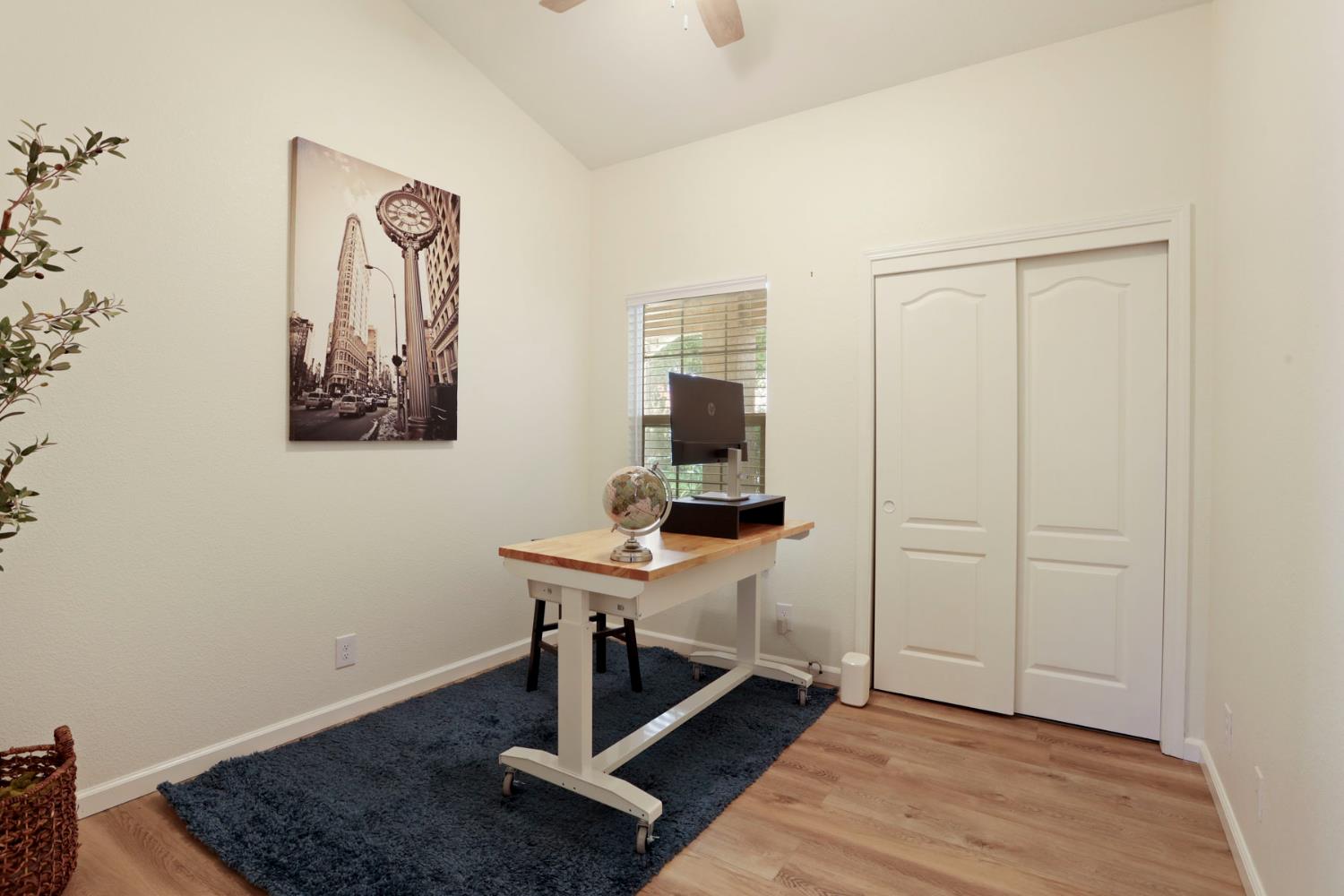 1505 Dreyfus Lane Modesto, CA 95355 - Photo 13 of 25 a room with a table and a potted plant