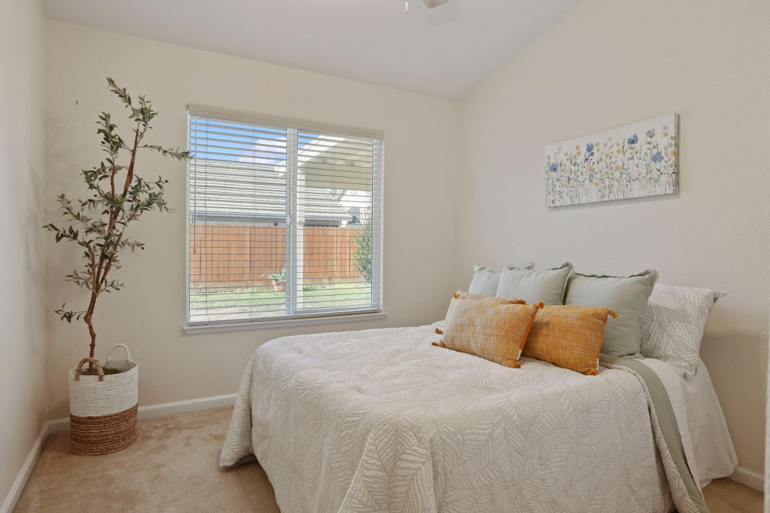 1505 Dreyfus Lane Modesto, CA 95355 - Photo 16 of 25 a bedroom with a bed and a window