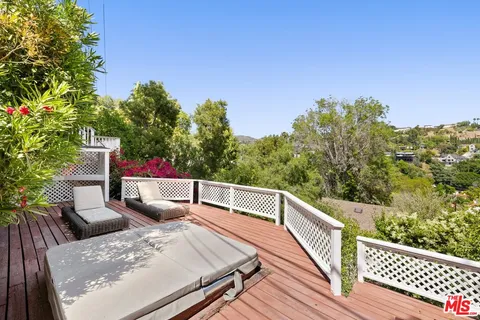 a view of balcony with furniture