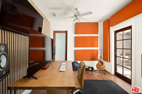 a bedroom with furniture and a window