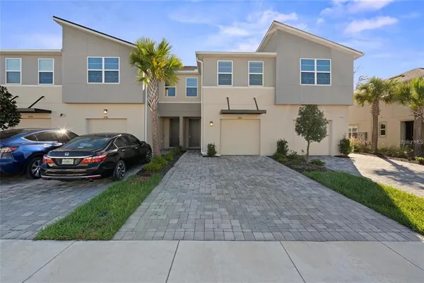 a view of a car park in front of house