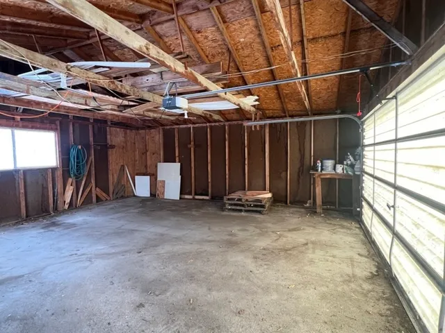 a view of a room with wooden walls