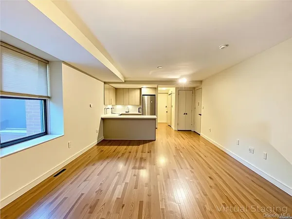 a view of a kitchen with wooden floor