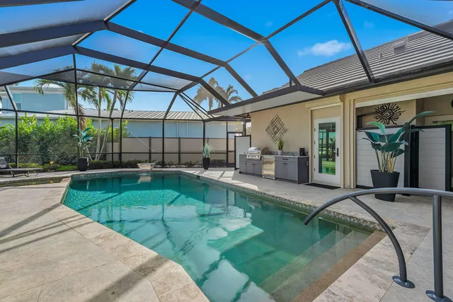a view of a swimming pool with a patio