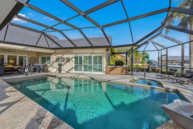 a view of a swimming pool with a patio