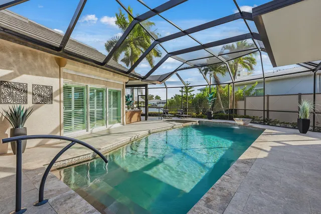 a view of a swimming pool with a porch
