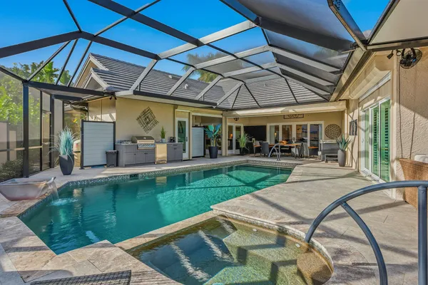 a view of swimming pool with a patio