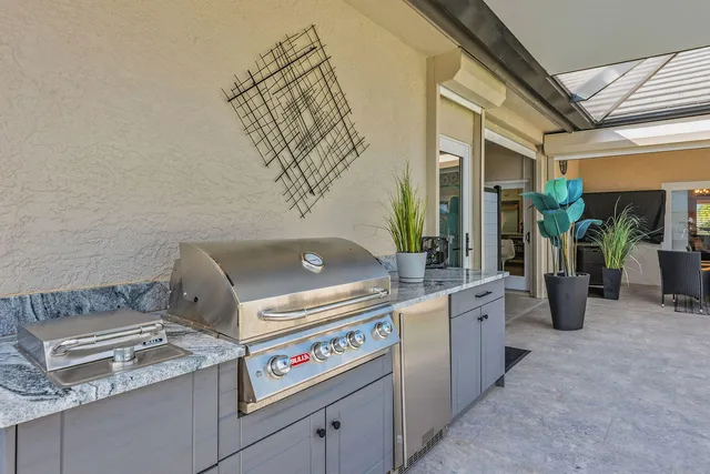 a kitchen with a stove and a white refrigerator