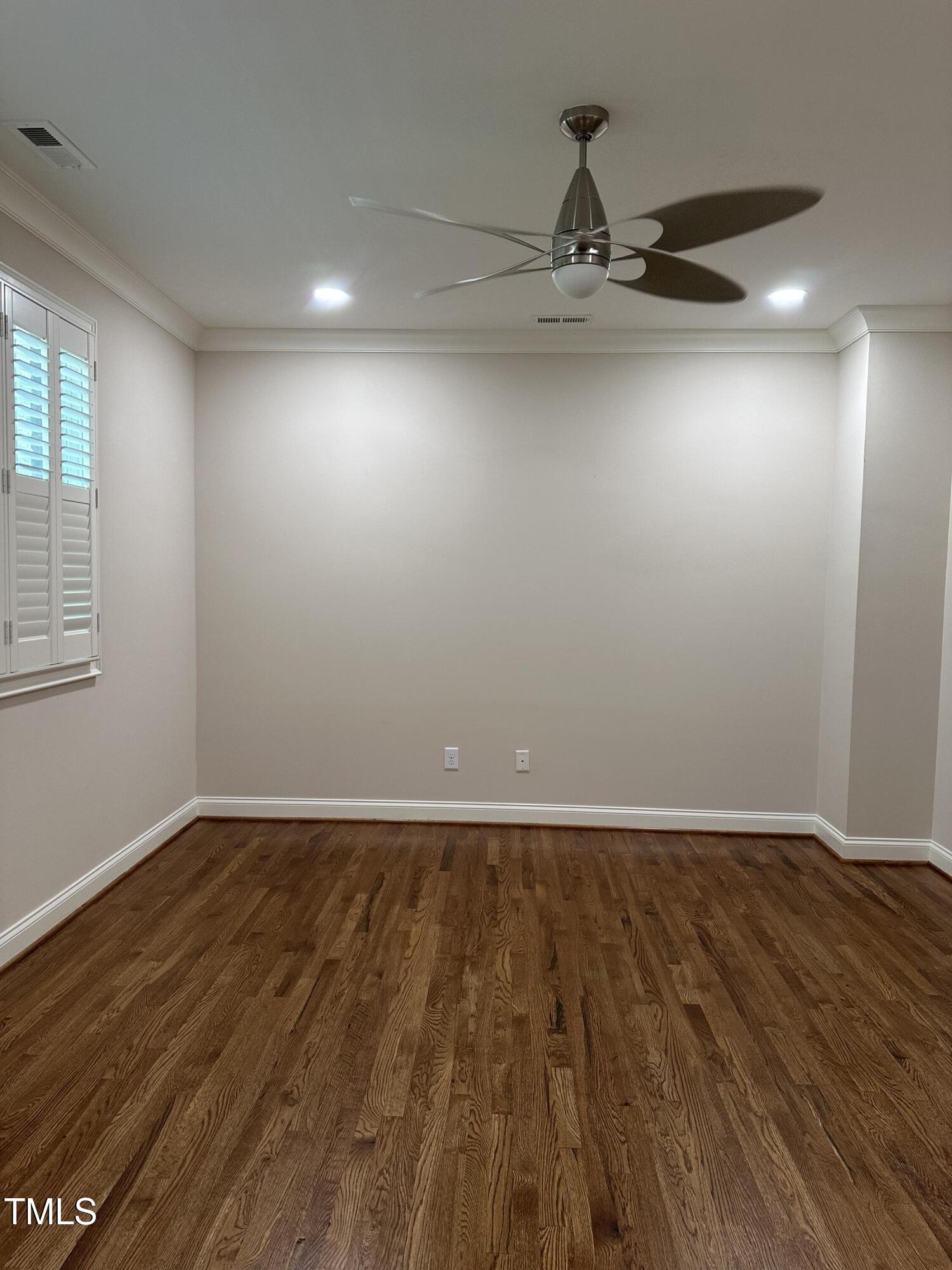 129 Cofield Circle Durham, NC 27707 - Photo 16 of 37 a view of an empty room with wooden floor and a window