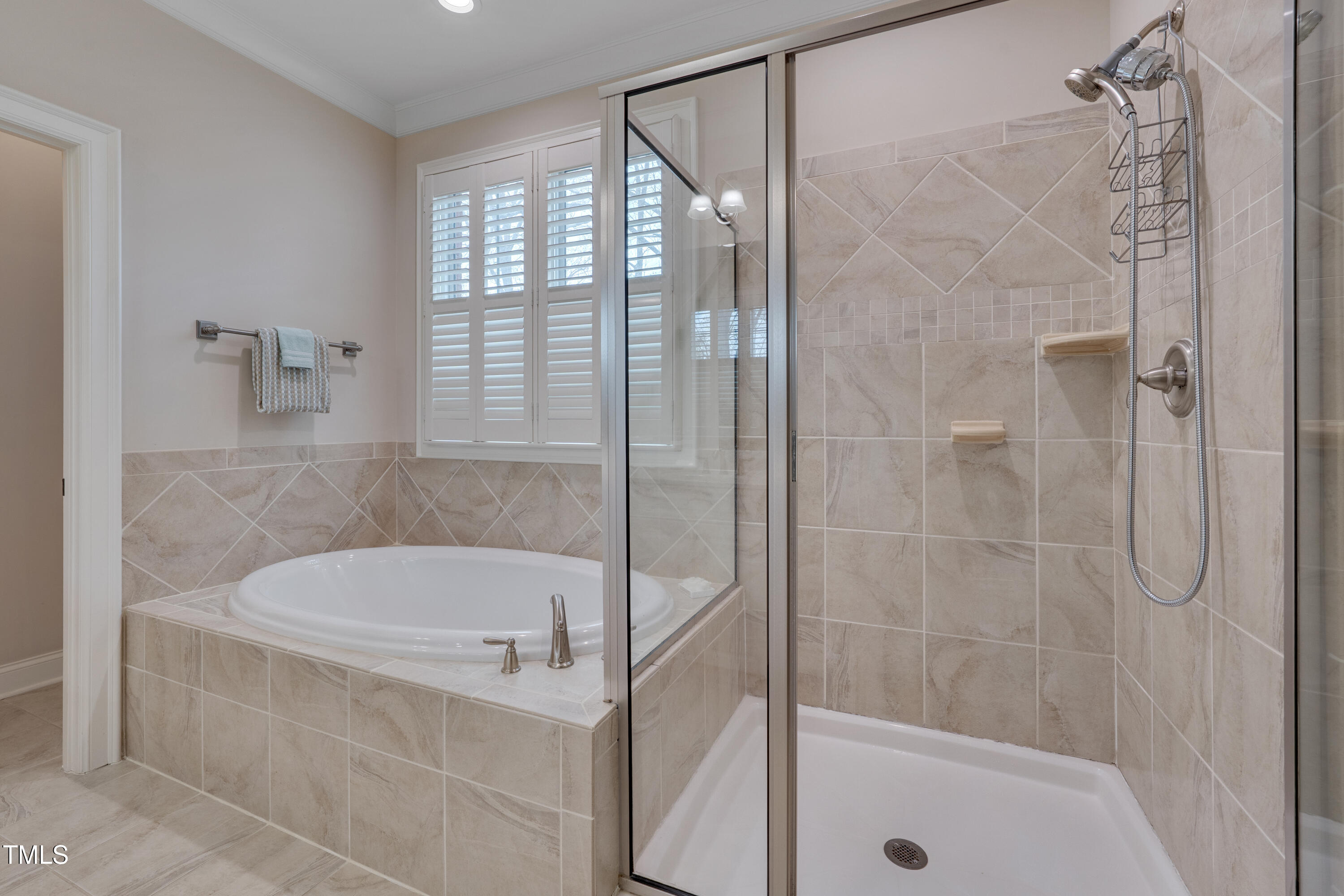 129 Cofield Circle Durham, NC 27707 - Photo 21 of 37 a white bath tub sitting next to a shower