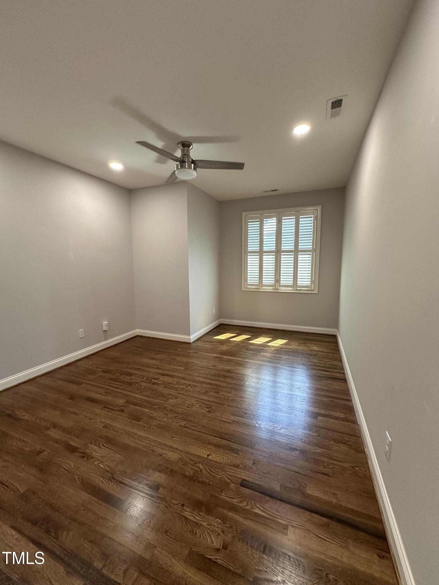 129 Cofield Circle Durham, NC 27707 - Photo 25 of 37 a view of empty room with wooden floor and fan
