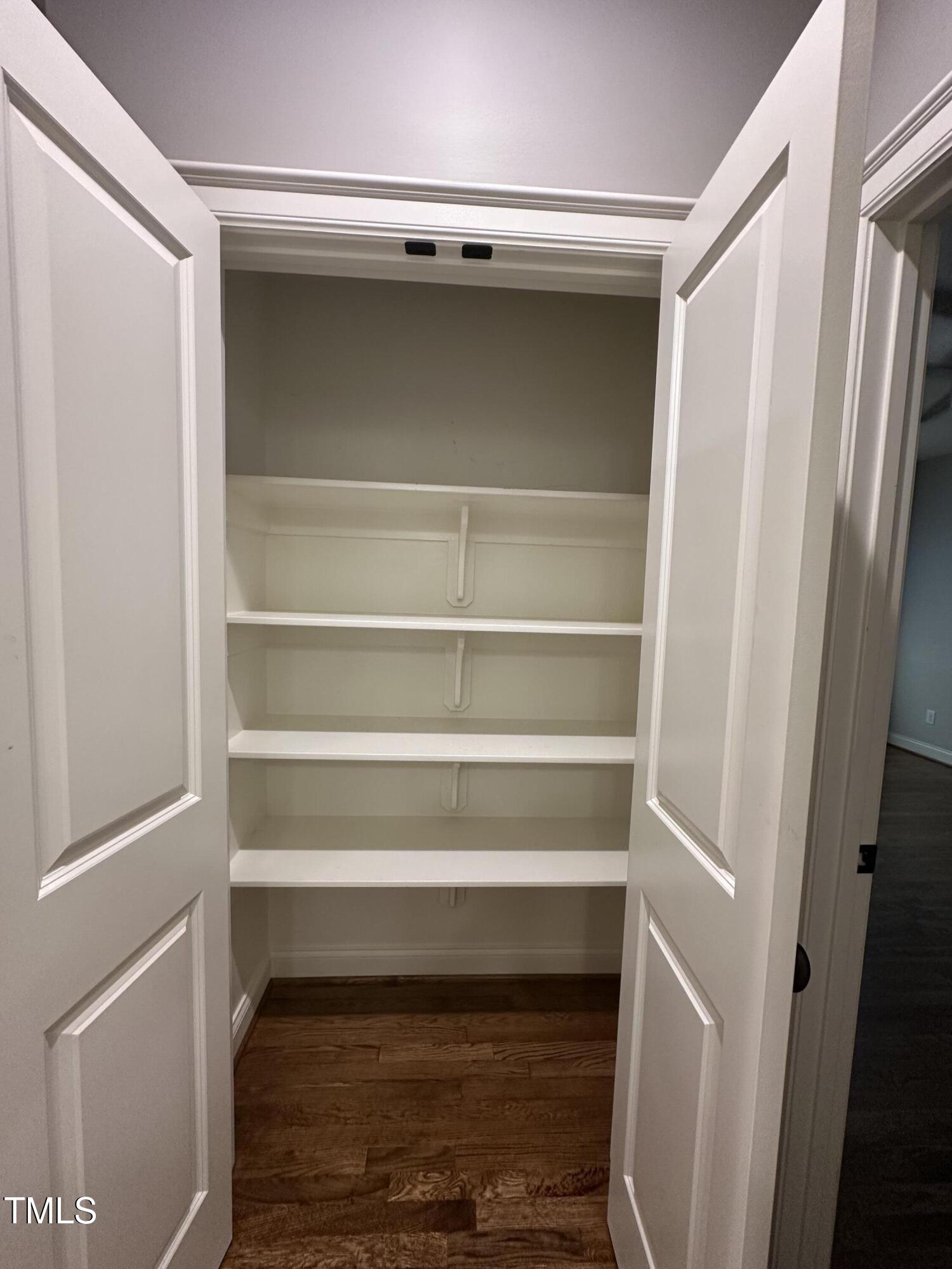 129 Cofield Circle Durham, NC 27707 - Photo 29 of 37 a view of walk in closet with empty racks