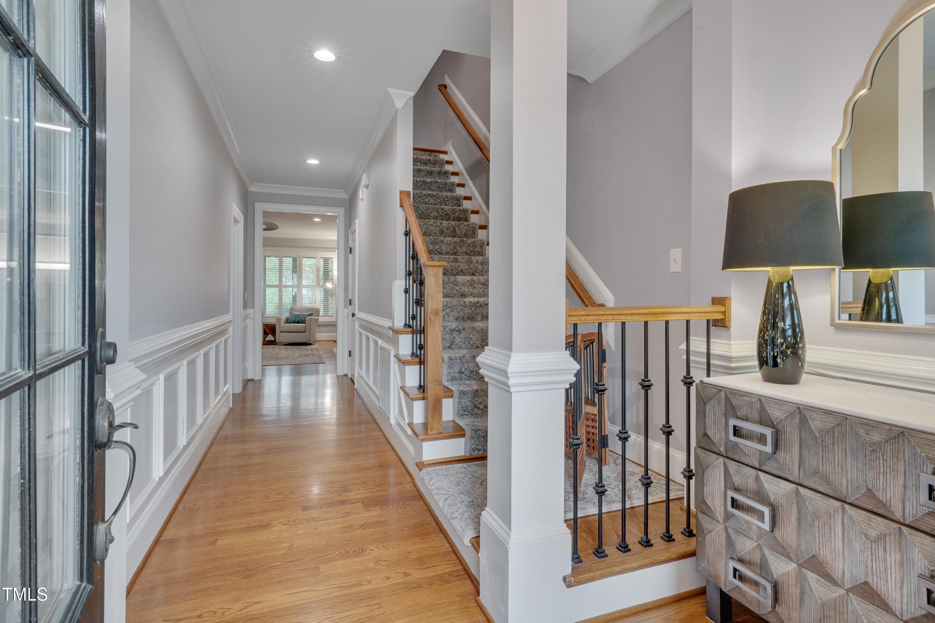 129 Cofield Circle Durham, NC 27707 - Photo 3 of 37 a view of a hallway with wooden floor and stairs