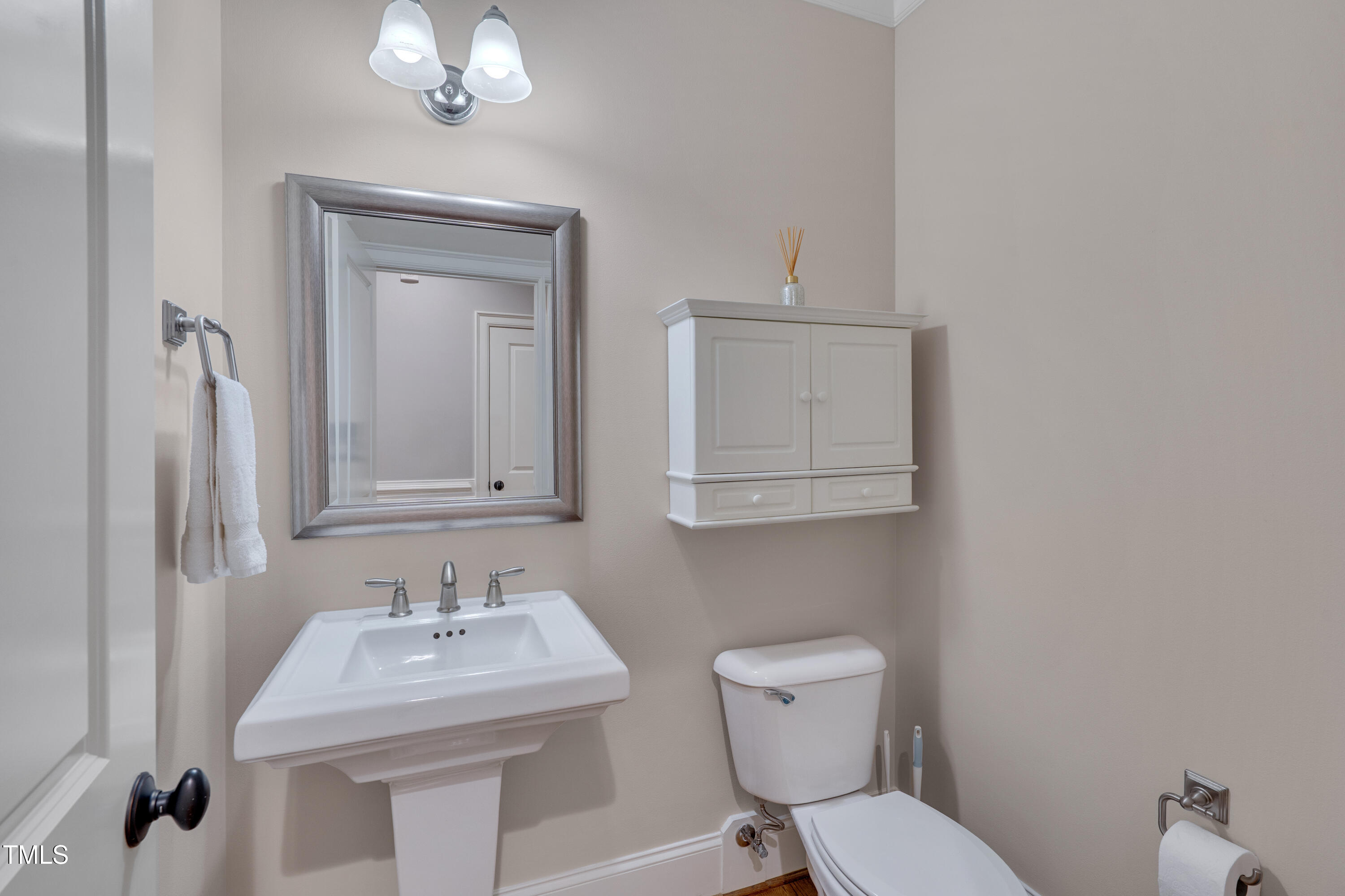 129 Cofield Circle Durham, NC 27707 - Photo 5 of 37 a bathroom with a toilet sink and mirror