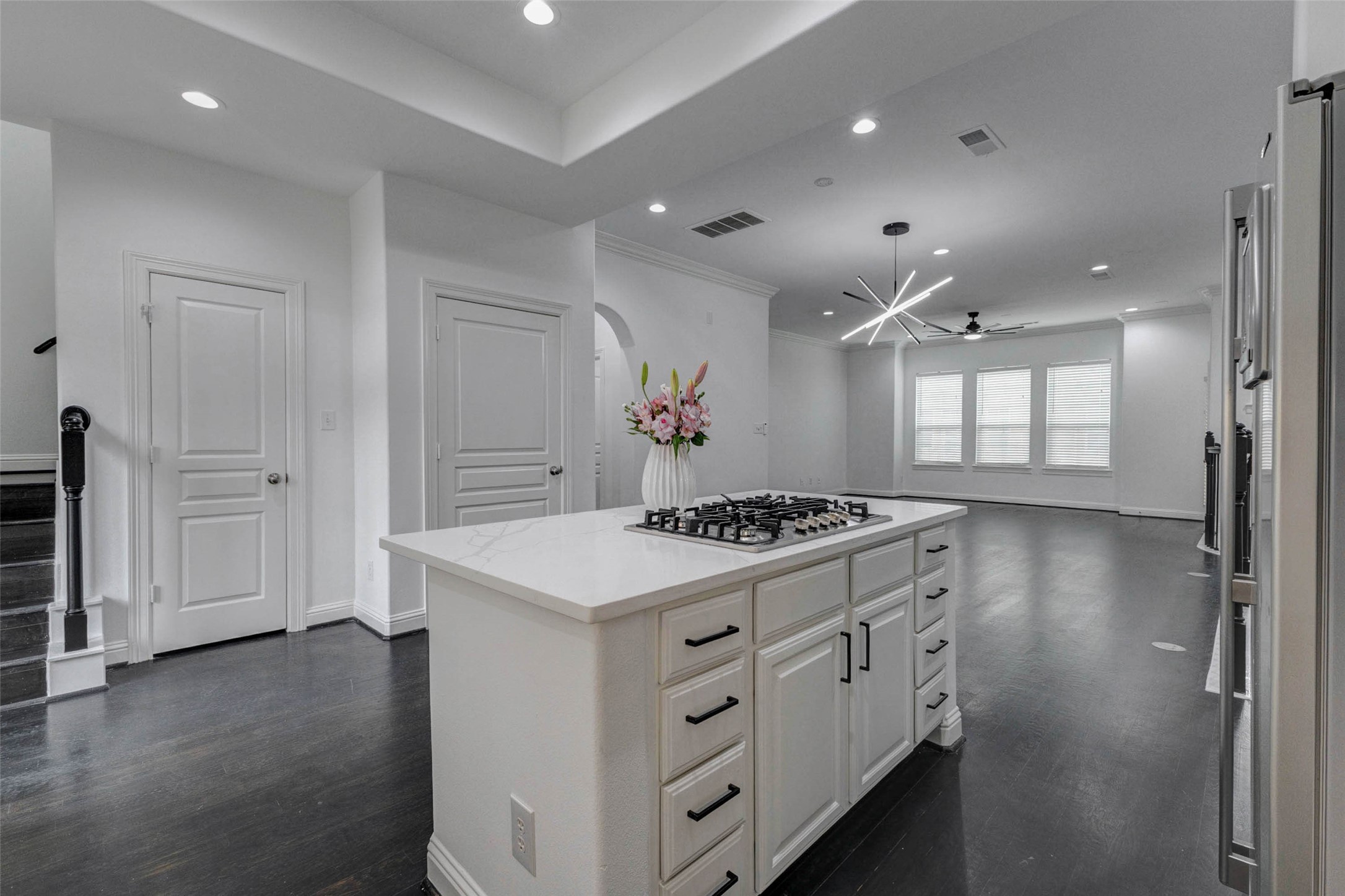 19 Versante Court Houston, TX 77070 - Photo 10 of 40 This kitchen features NEW: gas range, paint, hardware, countertops and lighting. The door to the left is the pantry, and the door on the right is the elevator shaft/extra closet.