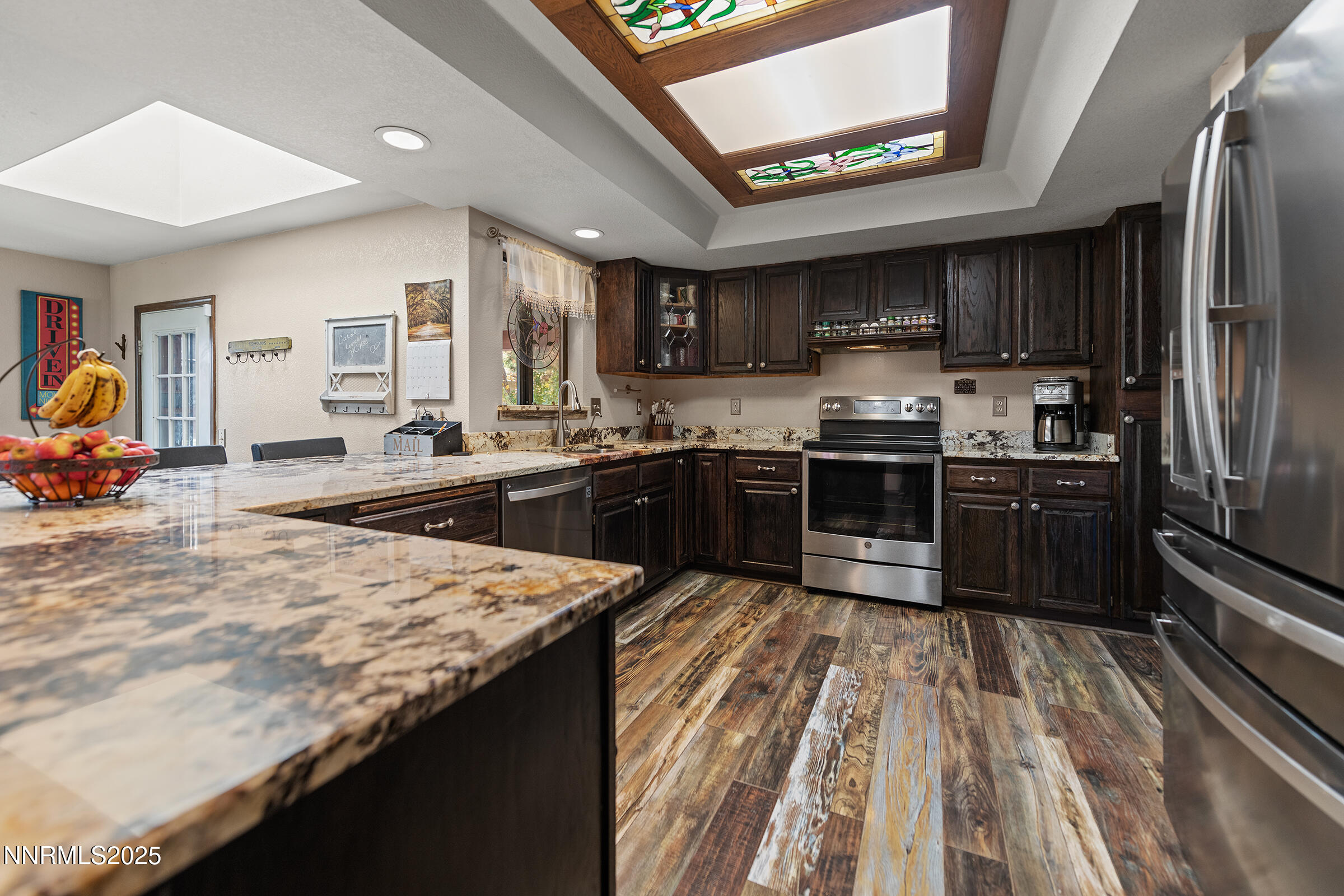2780 Mario Road Reno, NV 89523 - Photo 11 of 41 a kitchen with stainless steel appliances granite countertop a sink stove and refrigerator