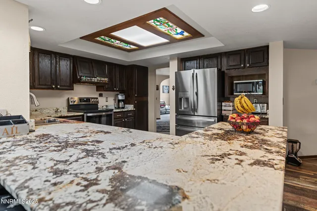 a bedroom with bed and a window