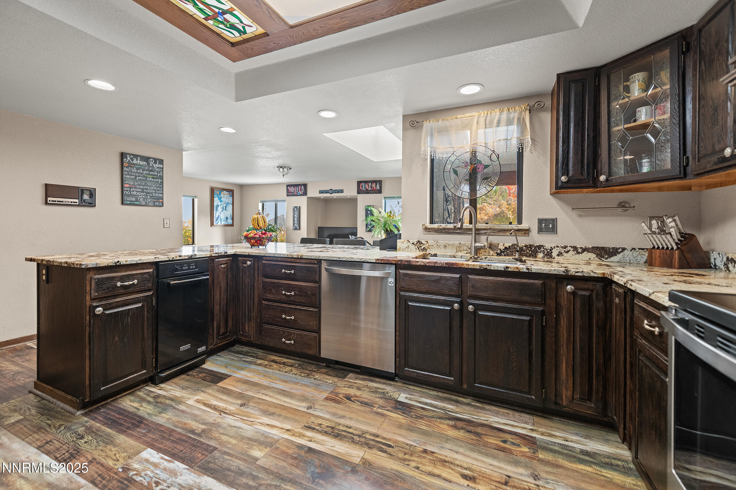 2780 Mario Road Reno, NV 89523 - Photo 14 of 41 a kitchen with a sink stove and cabinets
