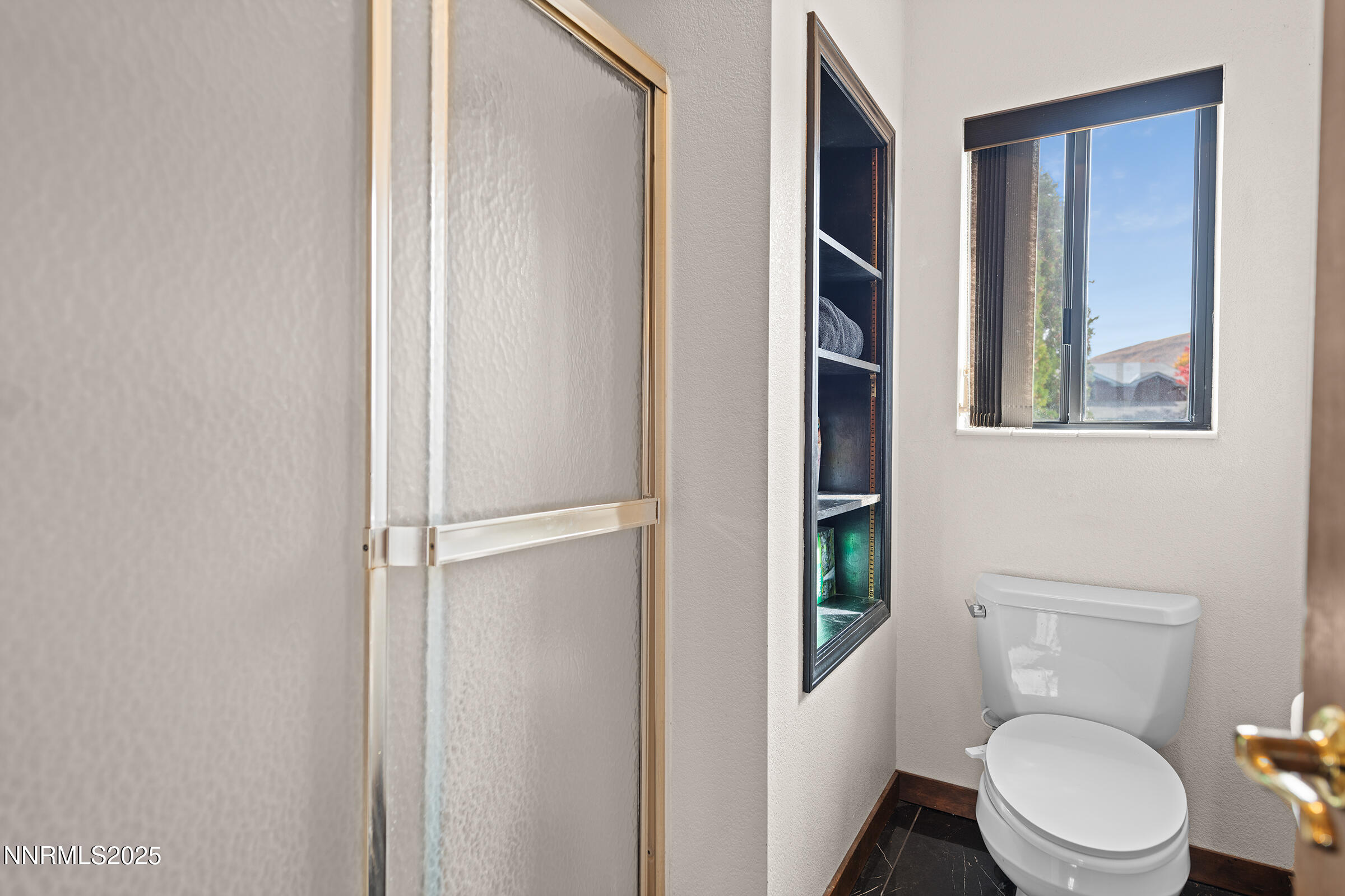 2780 Mario Road Reno, NV 89523 - Photo 26 of 41 a white toilet sitting next to a bathroom sink