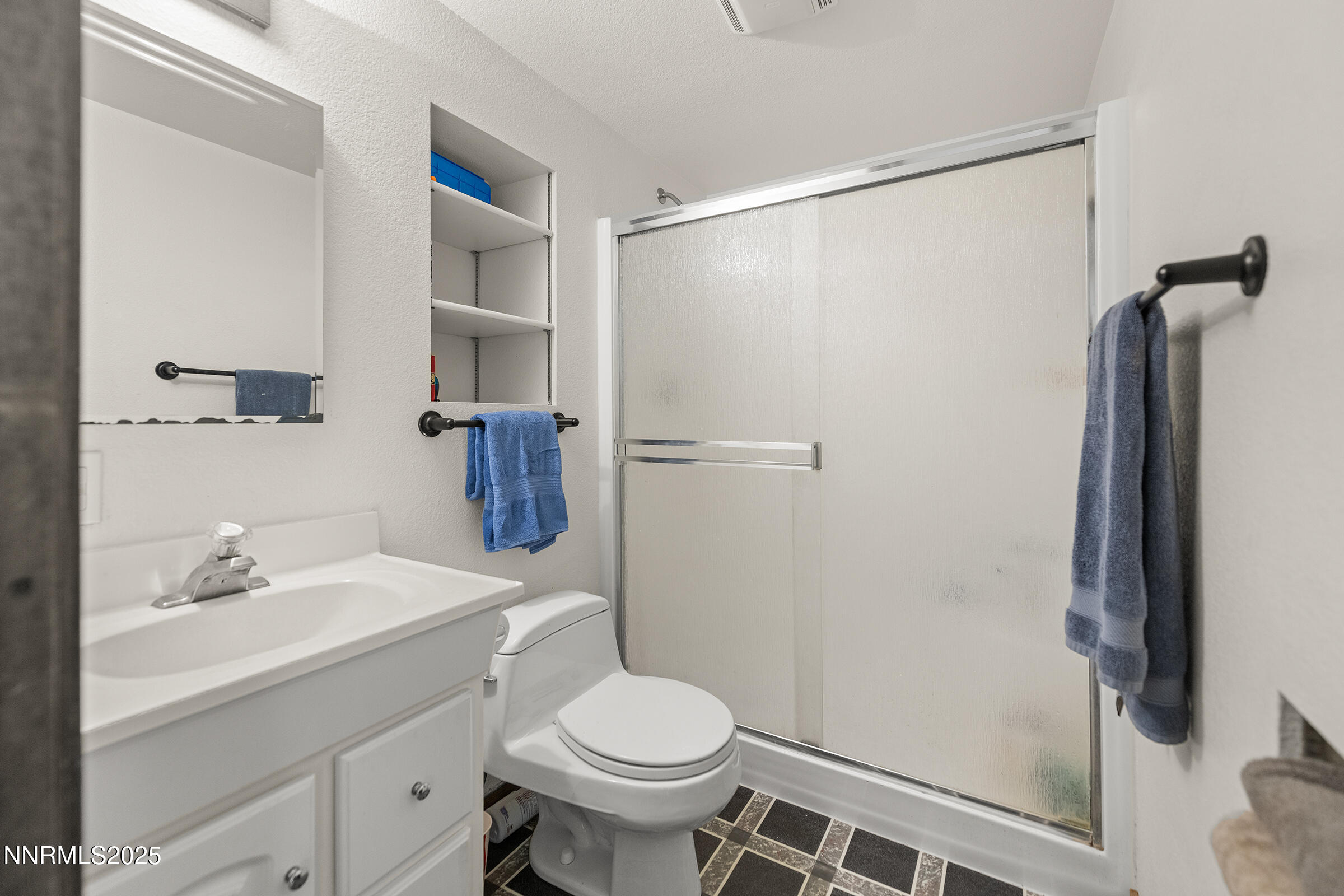 2780 Mario Road Reno, NV 89523 - Photo 31 of 41 a bathroom with a sink toilet and shower