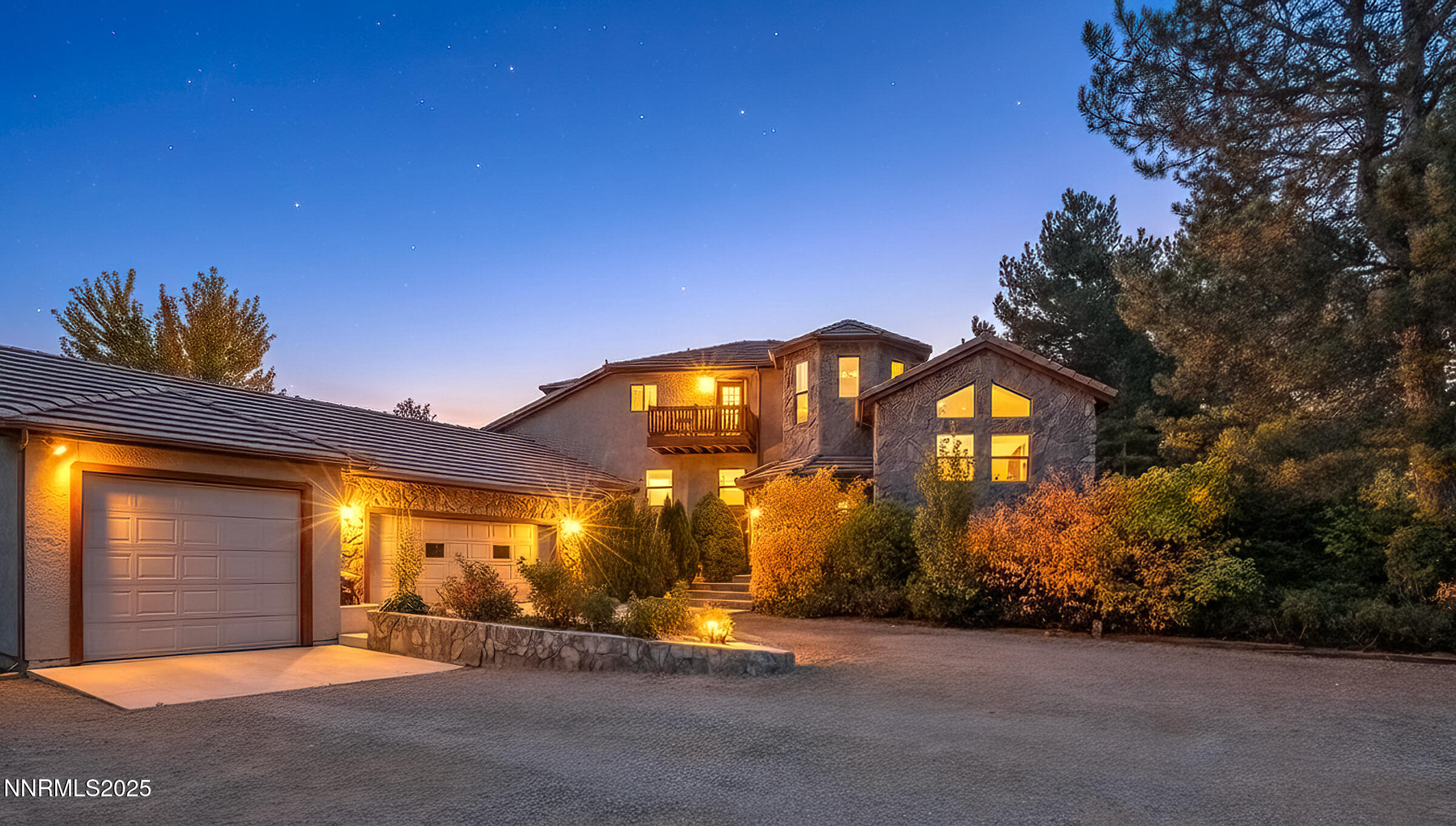 2780 Mario Road Reno, NV 89523 - Photo 40 of 41 a view of a brick house with large windows and a yard