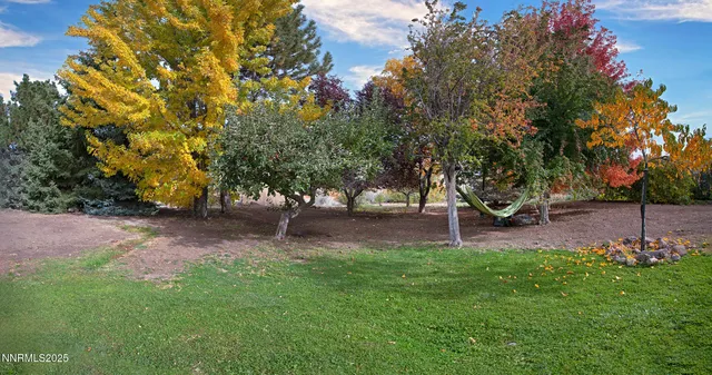 a kitchen with stainless steel appliances kitchen island granite countertop a refrigerator and a stove top oven