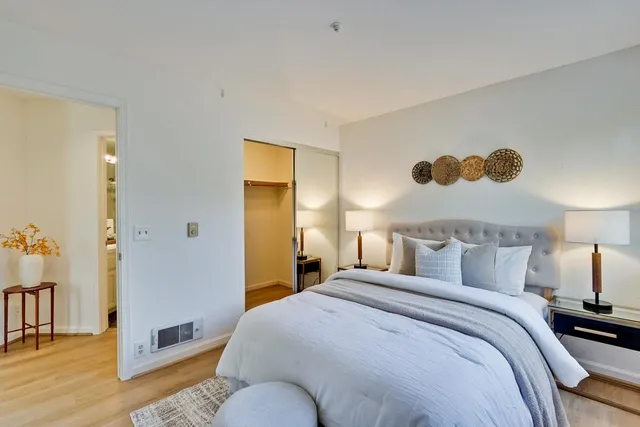 a bedroom with a bed and a walk in closet