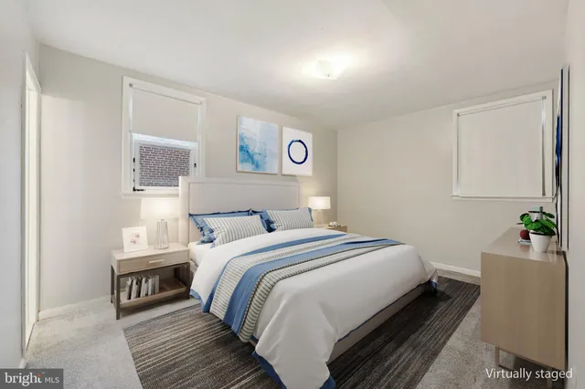 a bedroom with a bed and a couch