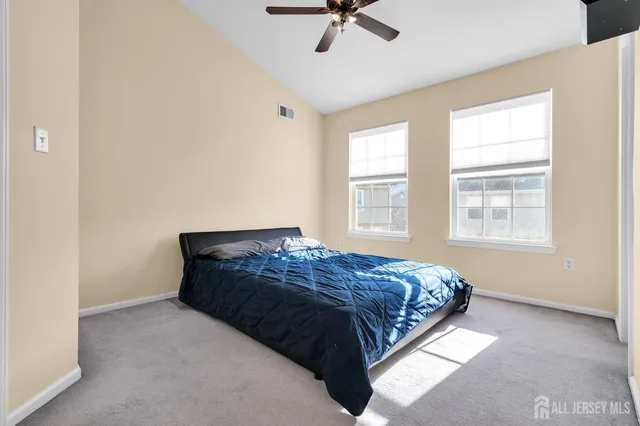 a bedroom with a bed and a closet